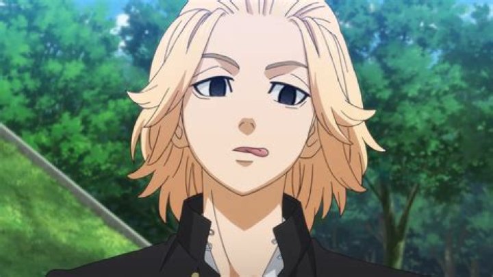 Mikey in season 1 of Tokyo Revengers has blood on his face but is smiling.
